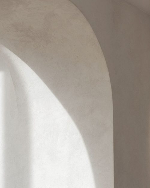 Copenhagen stucco wall with arch in off white plaster paint